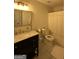 Bathroom features a vanity with marble countertop, gold hardware, and a toilet with a white shower curtain at 7050 Galloway Pt, Riverdale, GA 30296