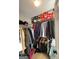 Walk-in closet with clothing racks, shoe boxes, and storage space for organization and functionality at 7050 Galloway Pt, Riverdale, GA 30296