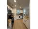 Well-equipped kitchen with stainless steel appliances, butcher block countertops, and bright lighting at 7050 Galloway Pt, Riverdale, GA 30296