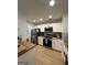 Modern kitchen featuring stainless steel appliances, butcher block countertops, and white cabinetry at 7050 Galloway Pt, Riverdale, GA 30296