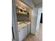 Laundry room with a washer and dryer, along with shelving space for storage and an open doorway at 7050 Galloway Pt, Riverdale, GA 30296