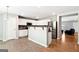Bright eat-in kitchen with stainless steel appliances and breakfast bar area with tile flooring at 1875 Cutleaf Creek Rd, Grayson, GA 30017