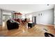 Inviting living room and dining area with hardwood floors, a dining table, and a comfortable seating arrangement at 1875 Cutleaf Creek Rd, Grayson, GA 30017