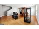 Open-concept living room and dining area with hardwood floors and a modern furniture arrangement at 1875 Cutleaf Creek Rd, Grayson, GA 30017