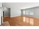 Bright and airy living room with hardwood floors, a fireplace, and multiple windows offering plenty of natural light at 1875 Cutleaf Creek Rd, Grayson, GA 30017