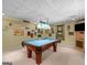 Basement featuring a pool table, carpet, and decorative wall hangings at 230 Cobblestone Ln, Mcdonough, GA 30252