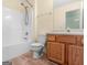 Bathroom with bathtub and shower combo next to the toilet and vanity at 230 Cobblestone Ln, Mcdonough, GA 30252