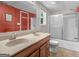 Bathroom featuring double sinks and a shower-tub combination at 230 Cobblestone Ln, Mcdonough, GA 30252