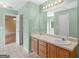 Spacious bathroom featuring double sink vanity, neutral tiling, and ample natural light at 230 Cobblestone Ln, Mcdonough, GA 30252