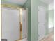 Bathroom with gold-trimmed shower and a large soaking tub at 230 Cobblestone Ln, Mcdonough, GA 30252