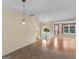 Open dining space with hardwood floors, offering seamless flow into the living area at 230 Cobblestone Ln, Mcdonough, GA 30252