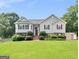 Charming two-story home with well-manicured lawn and cozy red shutters at 230 Cobblestone Ln, Mcdonough, GA 30252