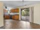 Well-lit kitchen with wooden cabinets and seamless access to the outdoor deck at 230 Cobblestone Ln, Mcdonough, GA 30252