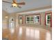 Bright, open living area with hardwood floors and large windows offering scenic views at 230 Cobblestone Ln, Mcdonough, GA 30252