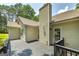The back of this home includes a chimney and a stained back deck at 100 Riveredge Dr, Mcdonough, GA 30252