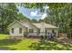 The back of the home includes a stained deck and a view of the large backyard at 100 Riveredge Dr, Mcdonough, GA 30252