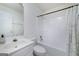 A well-lit bathroom features a tub-shower combo, white vanity, and neutral finishes at 100 Riveredge Dr, Mcdonough, GA 30252