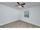 This bedroom features a ceiling fan, natural light, and wood-look floors at 100 Riveredge Dr, Mcdonough, GA 30252