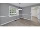 Inviting dining area featuring a chandelier and a large window with views of the outdoors at 100 Riveredge Dr, Mcdonough, GA 30252