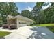 This home features a long driveway leading to an attached, two-car garage at 100 Riveredge Dr, Mcdonough, GA 30252