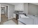Well-lit kitchen offering ample counter space, modern appliances, and convenient access to other areas at 100 Riveredge Dr, Mcdonough, GA 30252