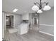 Open-concept kitchen showcasing the island and seamless flow into the dining and living spaces at 100 Riveredge Dr, Mcdonough, GA 30252