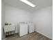 Practical laundry room features a utility sink, washer, and dryer for convenience at 100 Riveredge Dr, Mcdonough, GA 30252