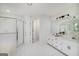 Main bathroom boasts a double vanity, tub, shower, and ample storage space at 100 Riveredge Dr, Mcdonough, GA 30252