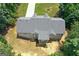 Bird's eye view of the home displaying the roof and backyard with a partially-finished basement at 225 Chinns Way, Hampton, GA 30228