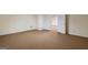 Basement area with large neutral carpet, multiple doors, and ample space at 225 Chinns Way, Hampton, GA 30228