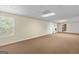 Large basement area with neutral carpet and ample space for storage or recreation at 225 Chinns Way, Hampton, GA 30228