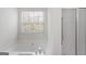 Relaxing bathroom features a soaking tub with shower and large window at 225 Chinns Way, Hampton, GA 30228