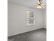 Bedroom featuring a ceiling fan, plush carpet and natural light from one window at 225 Chinns Way, Hampton, GA 30228