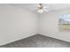 Bedroom with a ceiling fan, plush carpet and natural light from one window at 225 Chinns Way, Hampton, GA 30228