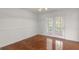Dining room featuring hardwood floors and glass paneled doors leading to the backyard at 225 Chinns Way, Hampton, GA 30228