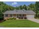 Charming single-story brick home with a well-maintained front yard and inviting entrance at 225 Chinns Way, Hampton, GA 30228