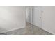 Hallway featuring neutral walls, white trim, and tile flooring at 225 Chinns Way, Hampton, GA 30228