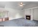 Bright living room with a fireplace and mantel that adds warmth to this comfortable living space at 225 Chinns Way, Hampton, GA 30228