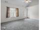 Cozy living room with plush carpeting and a ceiling fan at 225 Chinns Way, Hampton, GA 30228