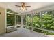 Bright sunroom with many windows that provide an excellent outdoor view at 225 Chinns Way, Hampton, GA 30228
