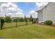 Beautifully maintained backyard with lush green grass and a black metal fence at 411 Southbridge Pass, Peachtree City, GA 30269