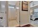 Bathroom view showing tiled floor and shower, with half open door to bedroom at 411 Southbridge Pass, Peachtree City, GA 30269