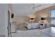 This charming bedroom has a ceiling fan and neutral colors at 411 Southbridge Pass, Peachtree City, GA 30269