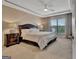 Cozy bedroom with tray ceiling, large window, and comfortable furnishings at 411 Southbridge Pass, Peachtree City, GA 30269