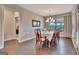 Beautiful dining room featuring hardwood floors, large windows, and elegant decor at 411 Southbridge Pass, Peachtree City, GA 30269