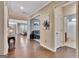 Hallway featuring hardwood floors, neutral walls, and access to multiple living spaces at 411 Southbridge Pass, Peachtree City, GA 30269