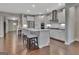 Modern kitchen featuring white cabinetry, stainless steel appliances, and a breakfast bar with seating at 411 Southbridge Pass, Peachtree City, GA 30269