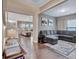 Comfortable living room featuring hardwood floors and access to the kitchen and dining spaces at 411 Southbridge Pass, Peachtree City, GA 30269