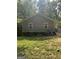 The backyard has lawn and a view of the back of the home at 1063 Nw Cato Nw St, Atlanta, GA 30318