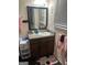 Well-lit bathroom with a vanity, mirror, and decorative accents, creating a clean and functional space at 1063 Nw Cato Nw St, Atlanta, GA 30318